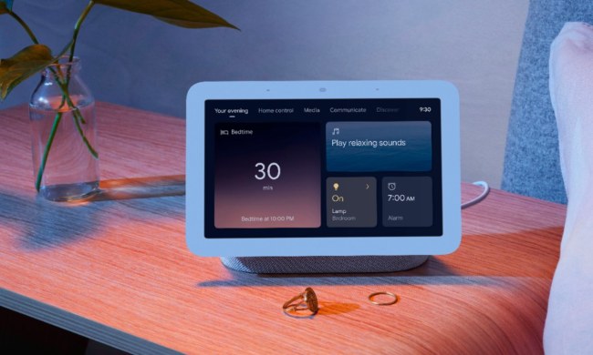 The Google Nest Hub Smart Display on a nightstand.